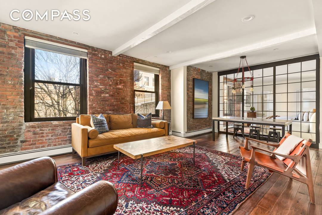 Stunning South Street Seaport Historic District Loft circa 1886 with a charming Brooklyn Bridge view and original exposed brick walls.