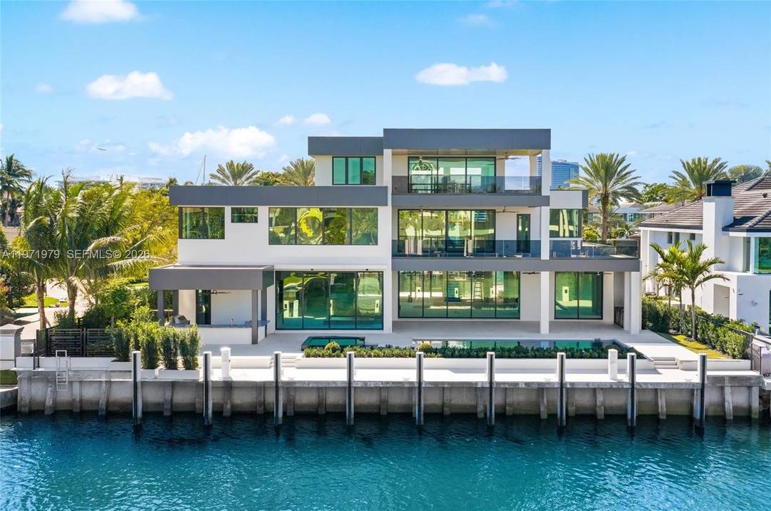 Where privacy, scale, and waterfront living converge, this newly constructed contemporary estate is situated within the guard gated enclave of Harbor Beach.