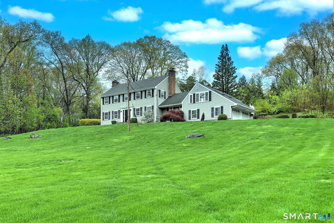 Experience timeless elegance and modern comfort in this classic home, tucked on a quiet cul de sac.