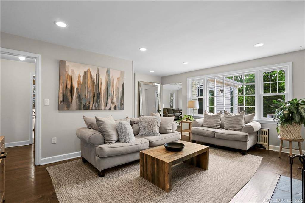 Spectacular open concept living in this deceivingly large cape in Springdale on a quiet dead end street.