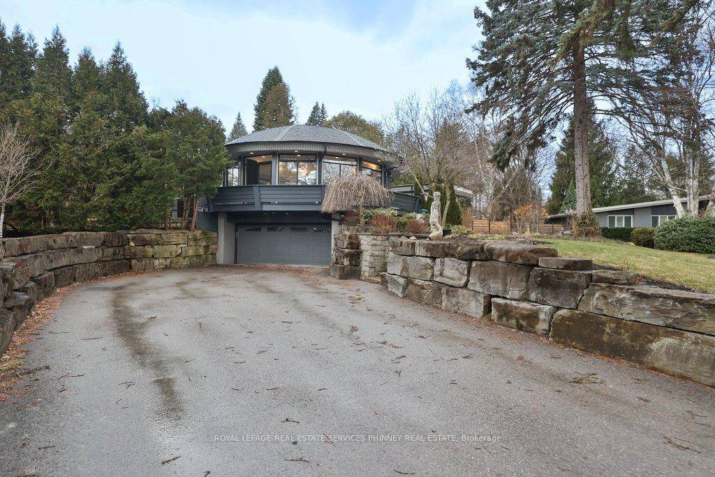 This exceptional luxury residence presents a rare opportunity to own a private, architecturally distinct home in one of Mississauga's most exclusive enclaves of Lorne Park.