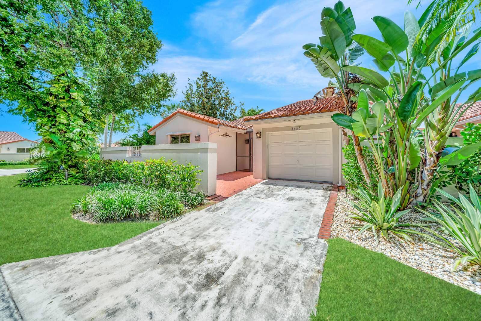 Renovated Waterfront Corner Villa in Brentwood of Boca on a Corner Lot featuring a spacious split floor plan with 3 bedrooms, 2 baths, 1 car garage !