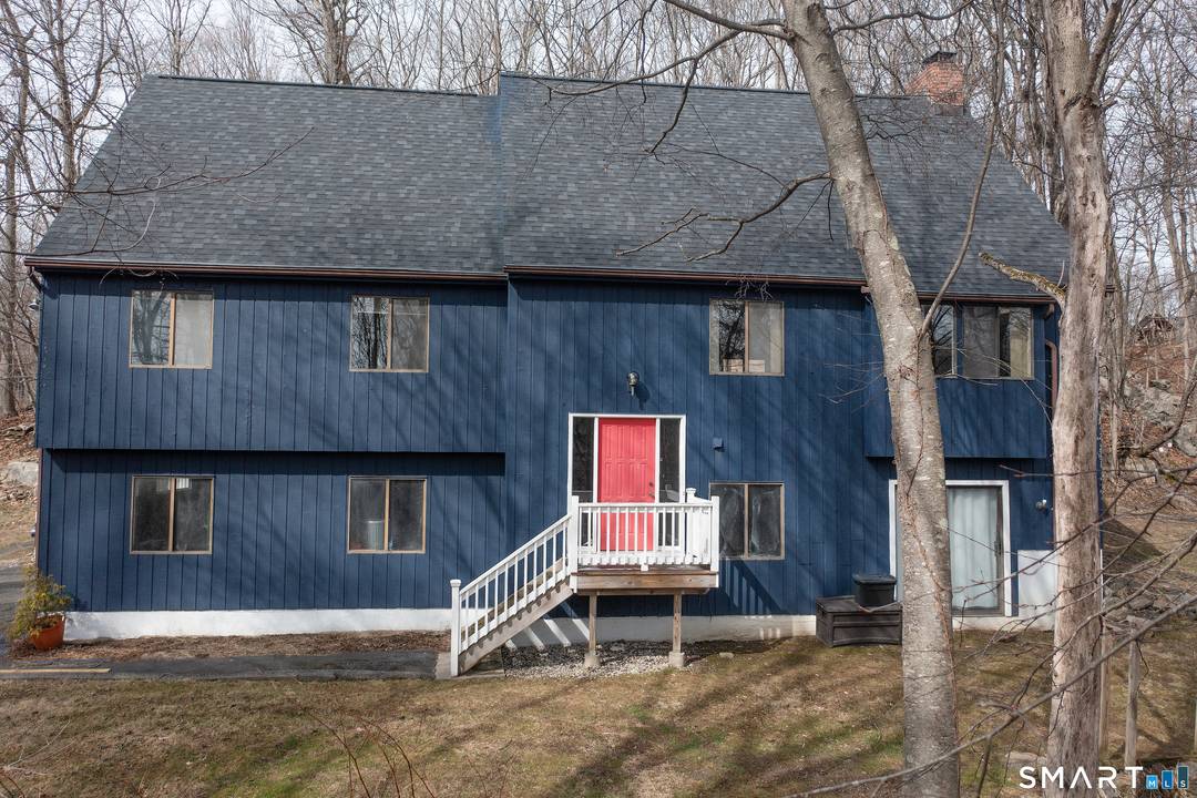 Welcome Home to this Contemporary style residence privately set on 2.