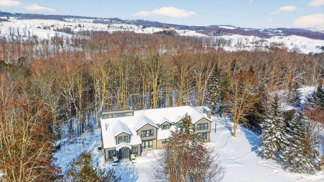 Set on an extraordinary 50 acre parcel just minutes from the heart of Creemore, this exceptional executive home offers refined living surrounded by a thriving natural ecosystem.