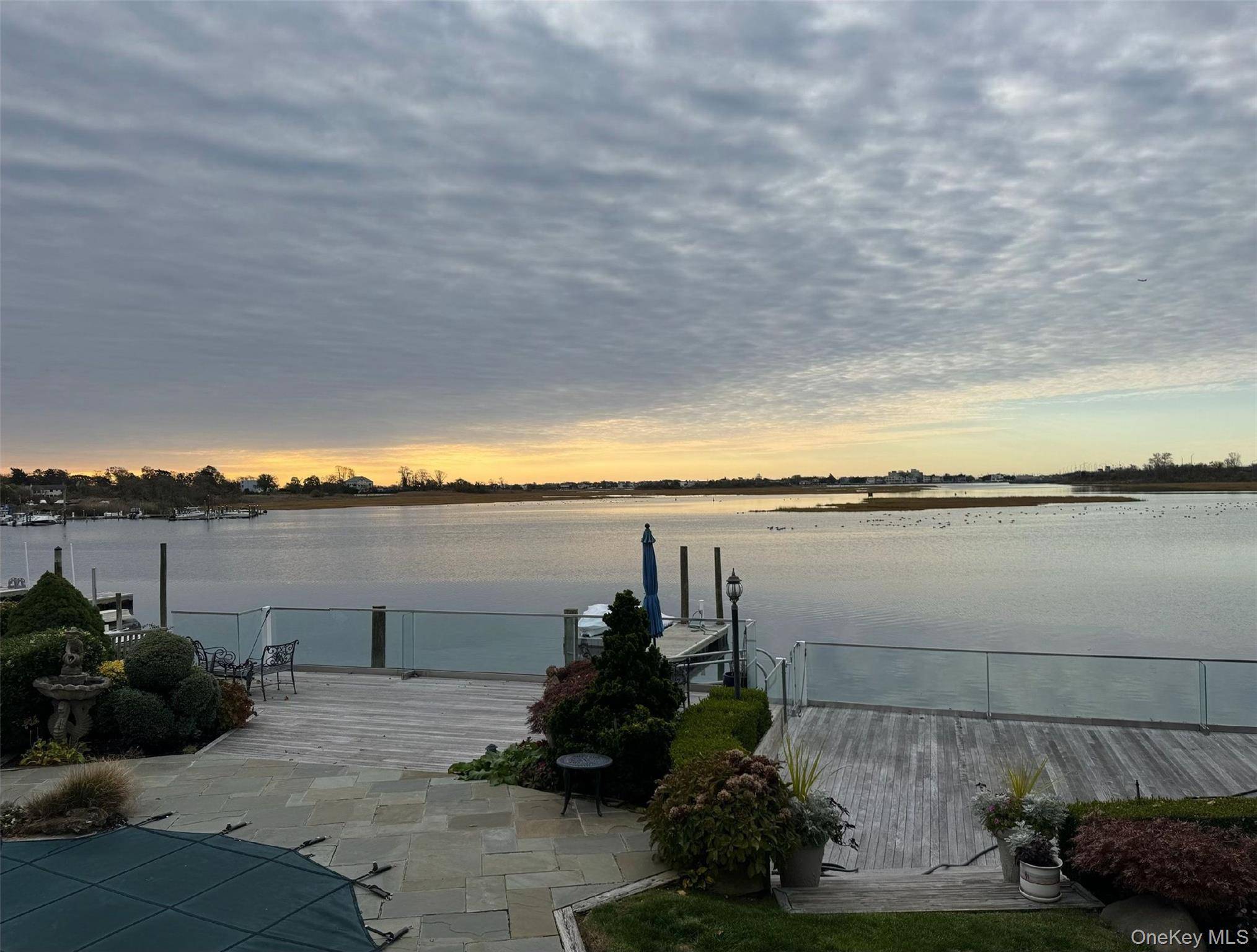 Magnificent waterfront estate in prestigious Lawrence Bay Park area.