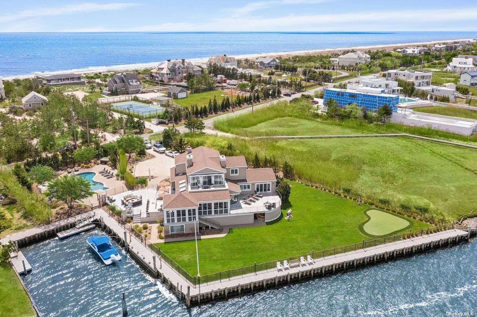 WELCOME TO BOATERS PARADISE The most exquisitely designed and meticulously crafted home in Quogue, with expansive views of the Quogue canal.
