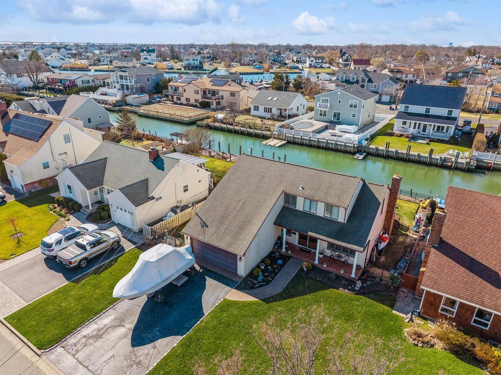 Welcome to this beautifully remodeled home nestled in a picturesque waterfront community on a deep canal.