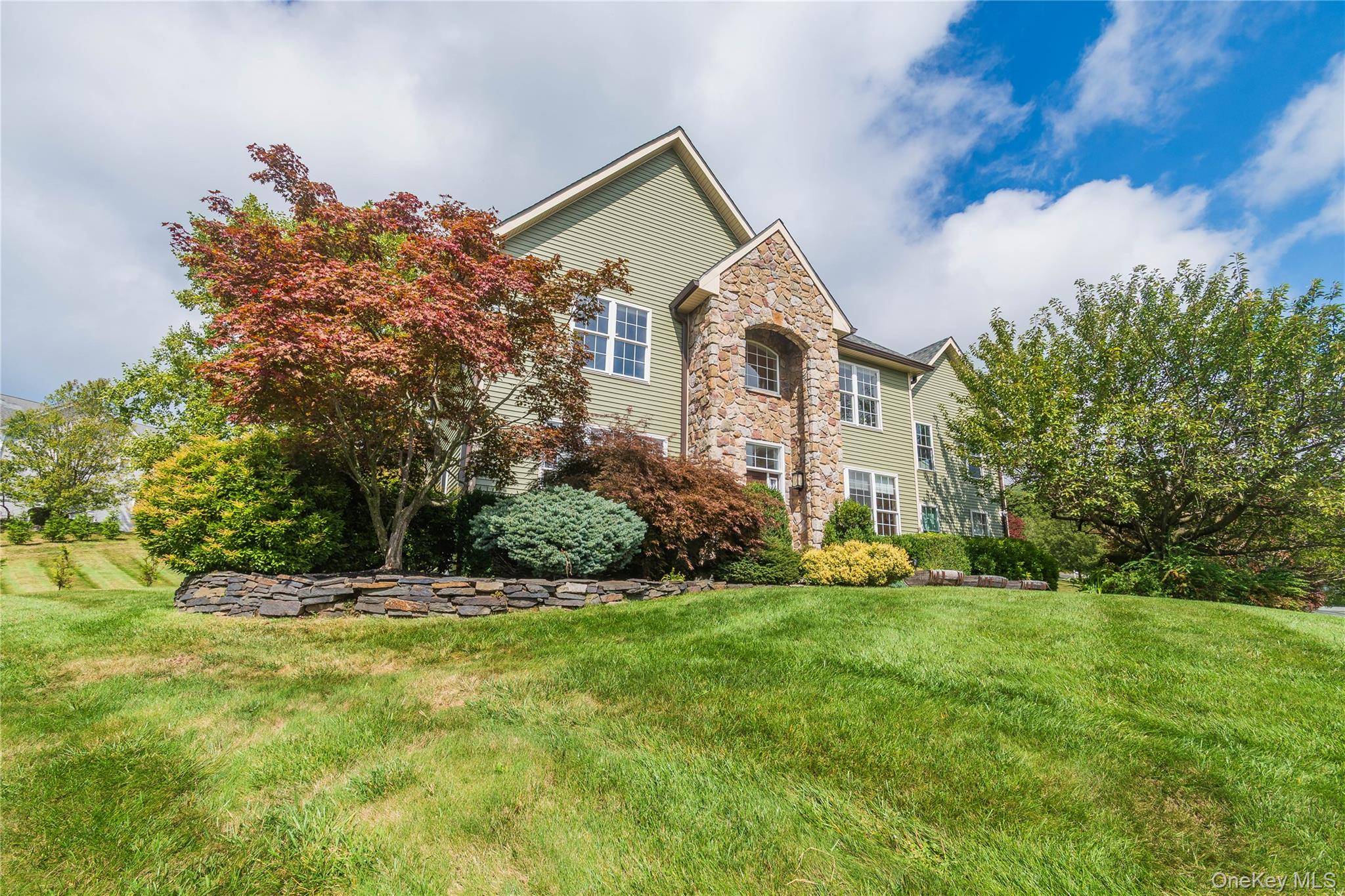 Welcome to this exceptional Colonial residence in the highly desirable Brigadoon community of Highland Mills.
