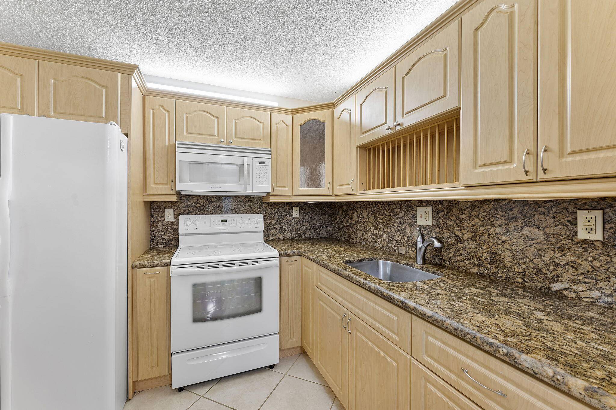 Aggressively priced for a quick sale, this 741 sq ft move in ready condo in Sandalfoot is one of the lowest priced all ages units in all of Boca Raton.
