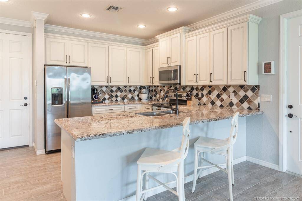 Welcome to 643 SW Glen Crest Way, a meticulously maintained res located in the desirable city of Stuart.