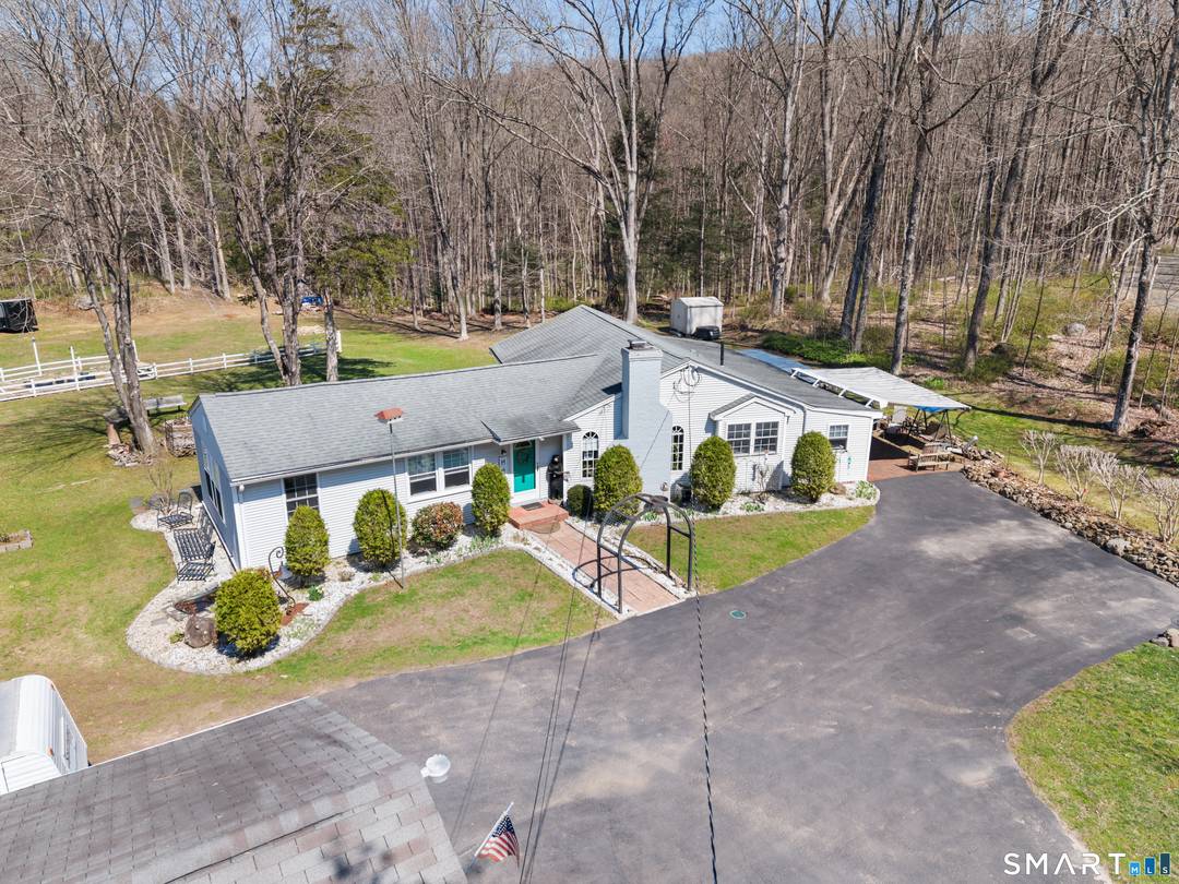 Discover this beautifully updated ranch style home ideally situated on over an acre of level, private land.