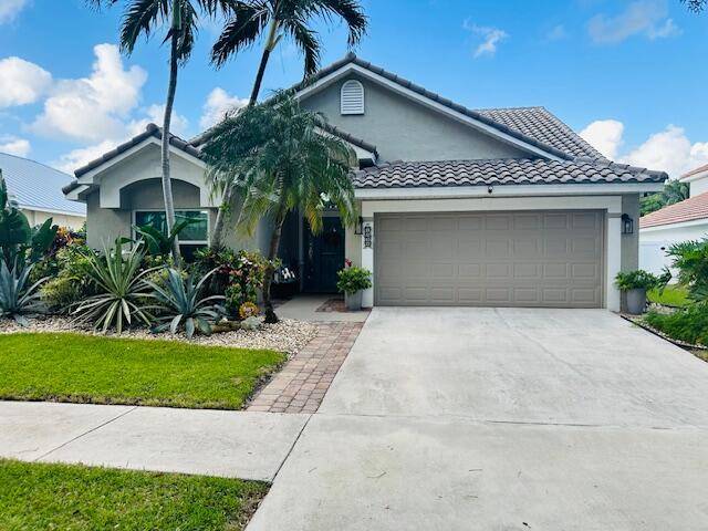 Welcome to Delray Lakes, an exclusive community with tree lined streets leading you to this exceptional residence.