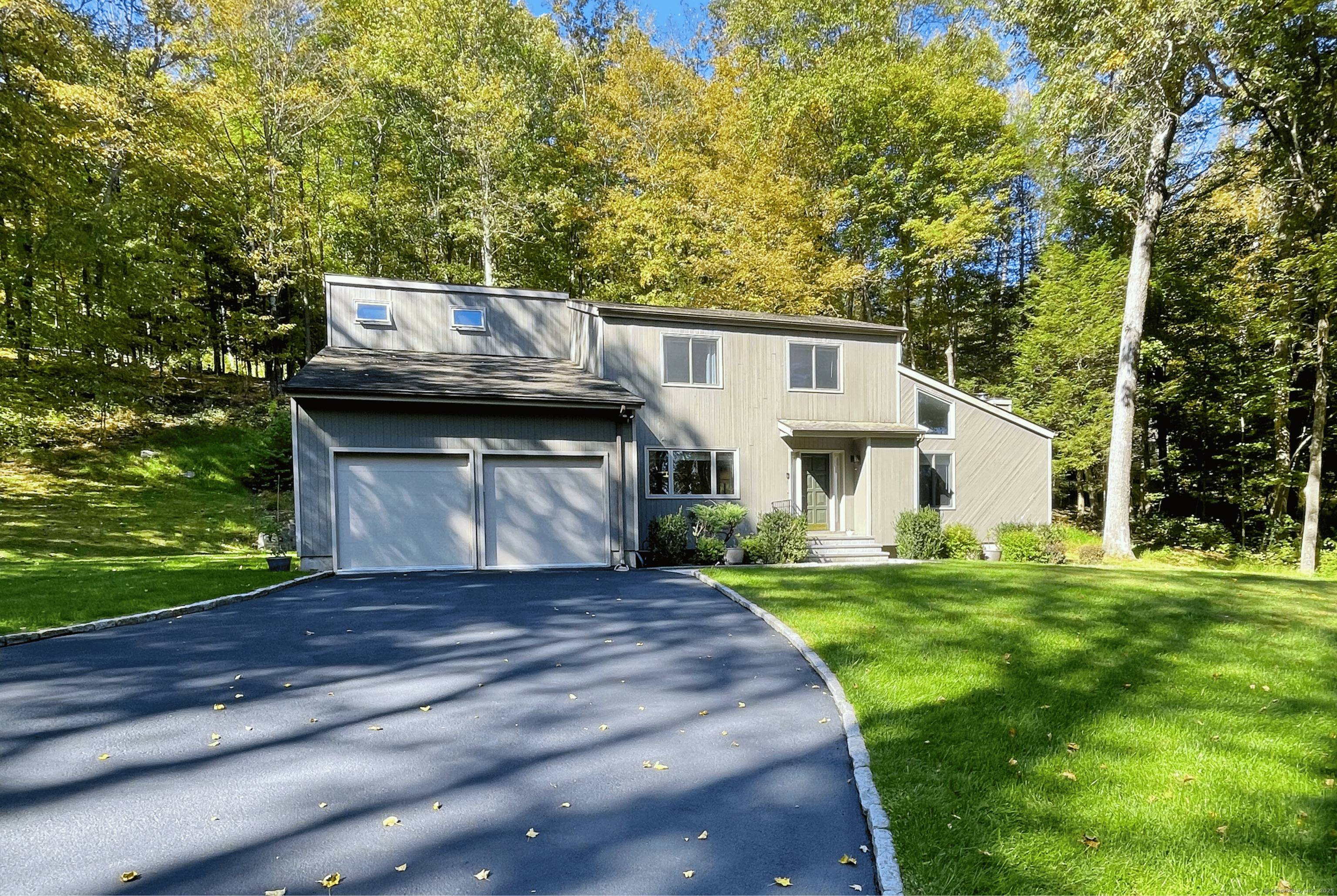 Tucked away at the end of a cul de sac and surrounded by woods, this beautifully maintained home offers privacy and tranquility on nearly 2 acres just minutes from the ...