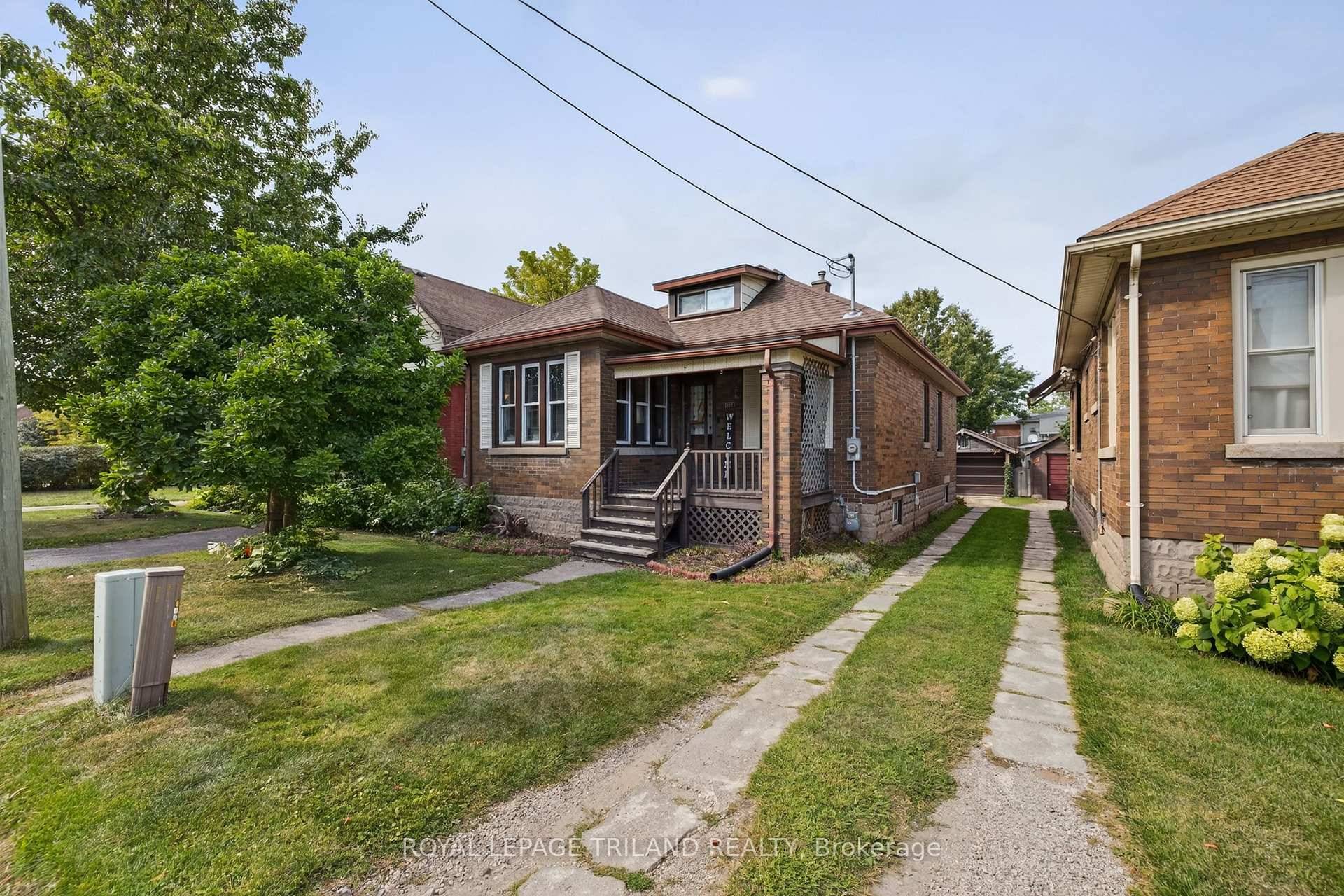 Welcome to this charming 2 bedroom, 1 bath brick bungalow full of character and possibility !