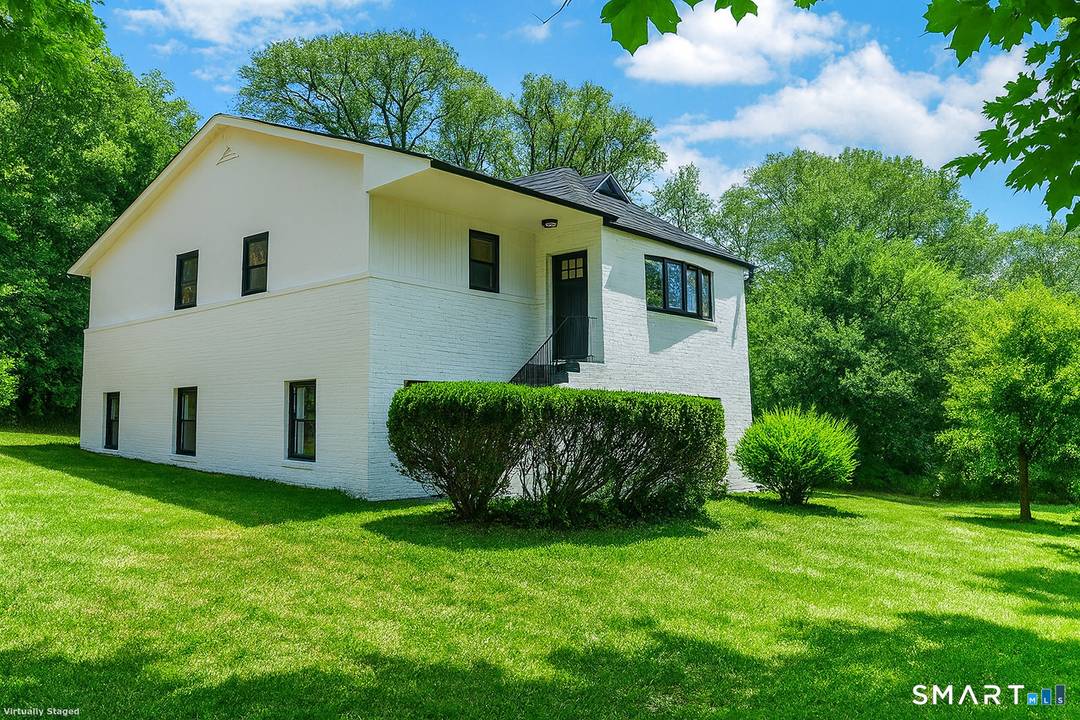 Welcome to 8 Fulton Drive, New Fairfield, CT a beautifully renovated home set on a rare double lot, nestled between Putnam Lake and Ball Pond.