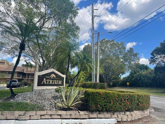 ALL AGES WELCOME ! ! PREPARE TO BE CAPTIVATED BY SERENE WATER VIEWS AND AN EXPANSIVE WRAPAROUND PORCH IN THIS BEAUTIULLY SITUATED FIRST FLOOR CORNER UNIT IN THE ATRIUM.