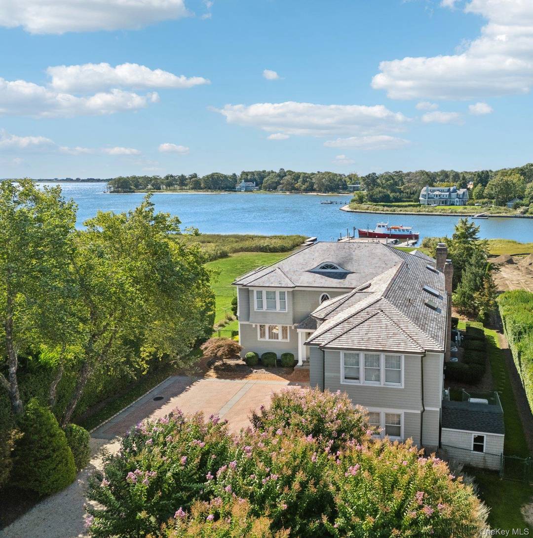 Set along East Quogue s highly sought after Sunset Avenue, this 1.