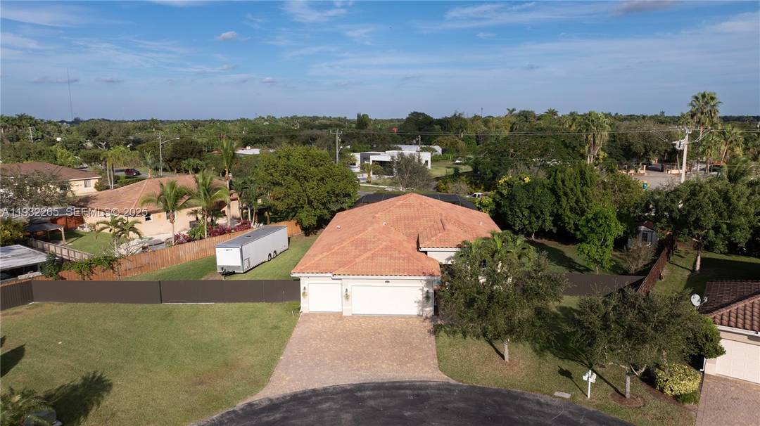 Exquisite Florida living awaits in this stunning 4 bedroom, 3 bath residence, on an oversized lot within a serene, private cul de sac.