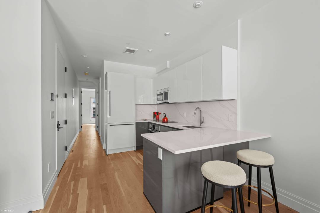 Welcome to this beautiful 1, 048 square foot penthouse duplex townhouse with two bedrooms, two bathrooms, and two private rooftop terraces.