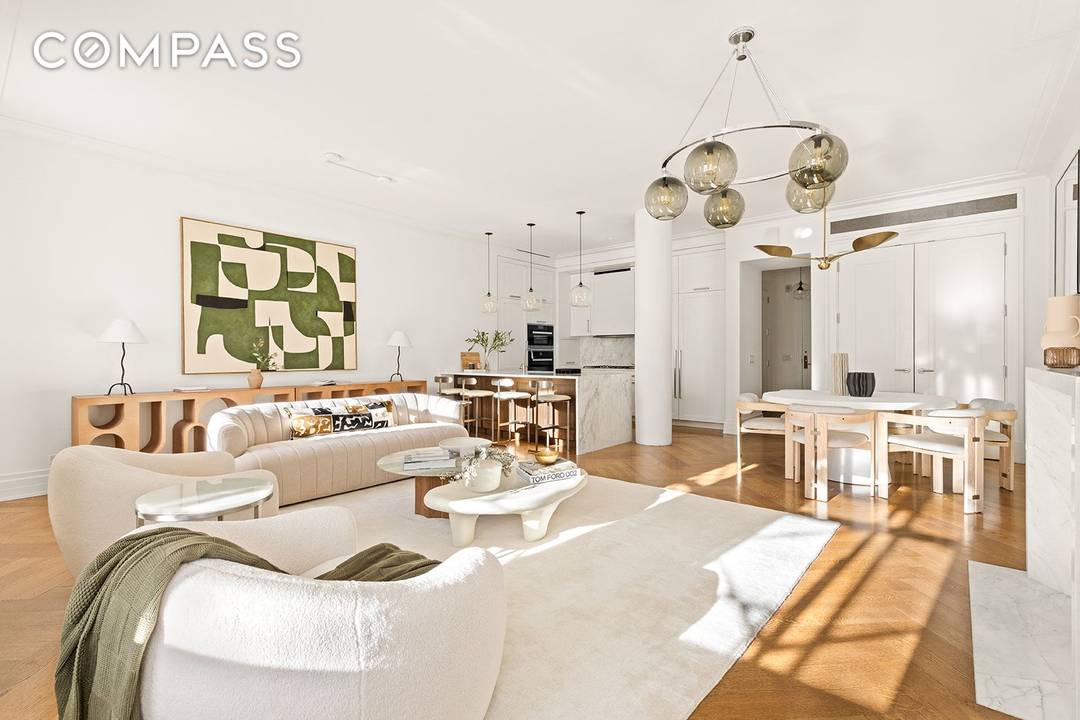 Welcome to Unit 705, a corner residence with a breathtaking, sun filled great room framed by a south facing bay window and a working wood burning fireplace.