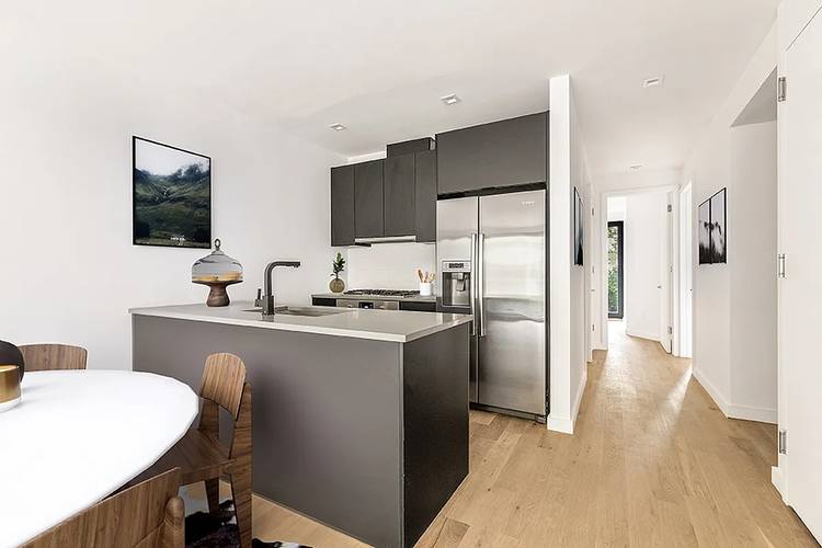 Unit 3 offers a spacious layout with three bedrooms, two full baths, and a large living and dining area filled with natural light from both Southern and Northern exposures, complemented ...