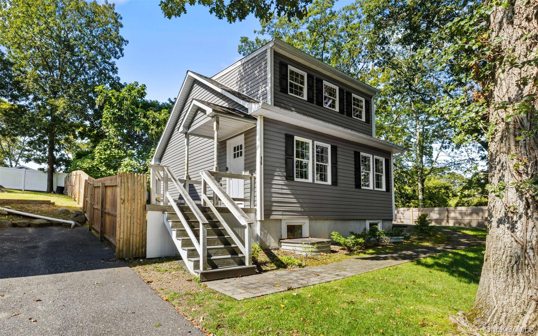 Just steps from the sand at Friendship Beach, this immaculate 3 bedroom or flex 4 bedroom home captures the best of North Shore living.