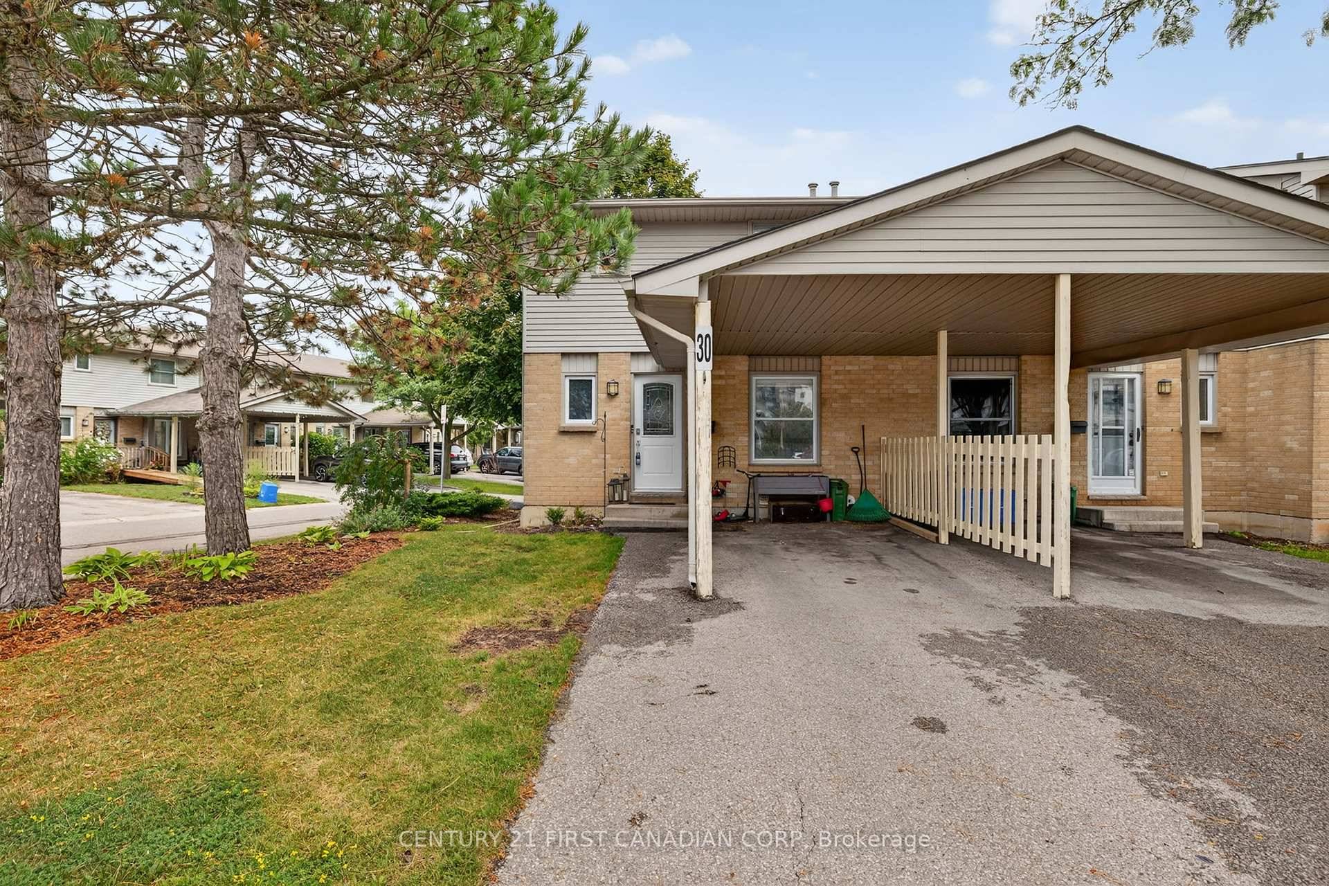 Welcome to 55 Ashley Crescent, Unit 30 a bright and spacious corner townhouse nestled in the desirable White Oaks neighborhood.
