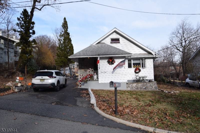 VALUE IS IN THE LAND. Nearly a half acre flat property within easy access to NYC transportation Route US 46 Route NJ 3.