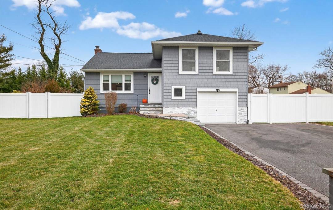 Beautifully renovated split level home set on manicured, park like grounds truly move in ready with exceptional pride of ownership throughout.