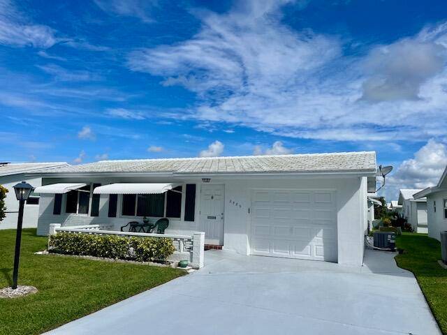 Sparkling Clean Pics coming single family home w 1 car garage in Palm Beach Leisureville, which is a 55 age community.
