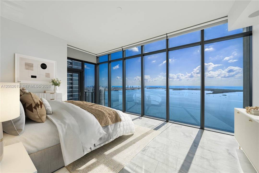 A rare half floor lower penthouse at Echo Brickell 2, 117 SF of curated luxury with sweeping, unobstructed views of Biscayne Bay and the Miami skyline from every room.