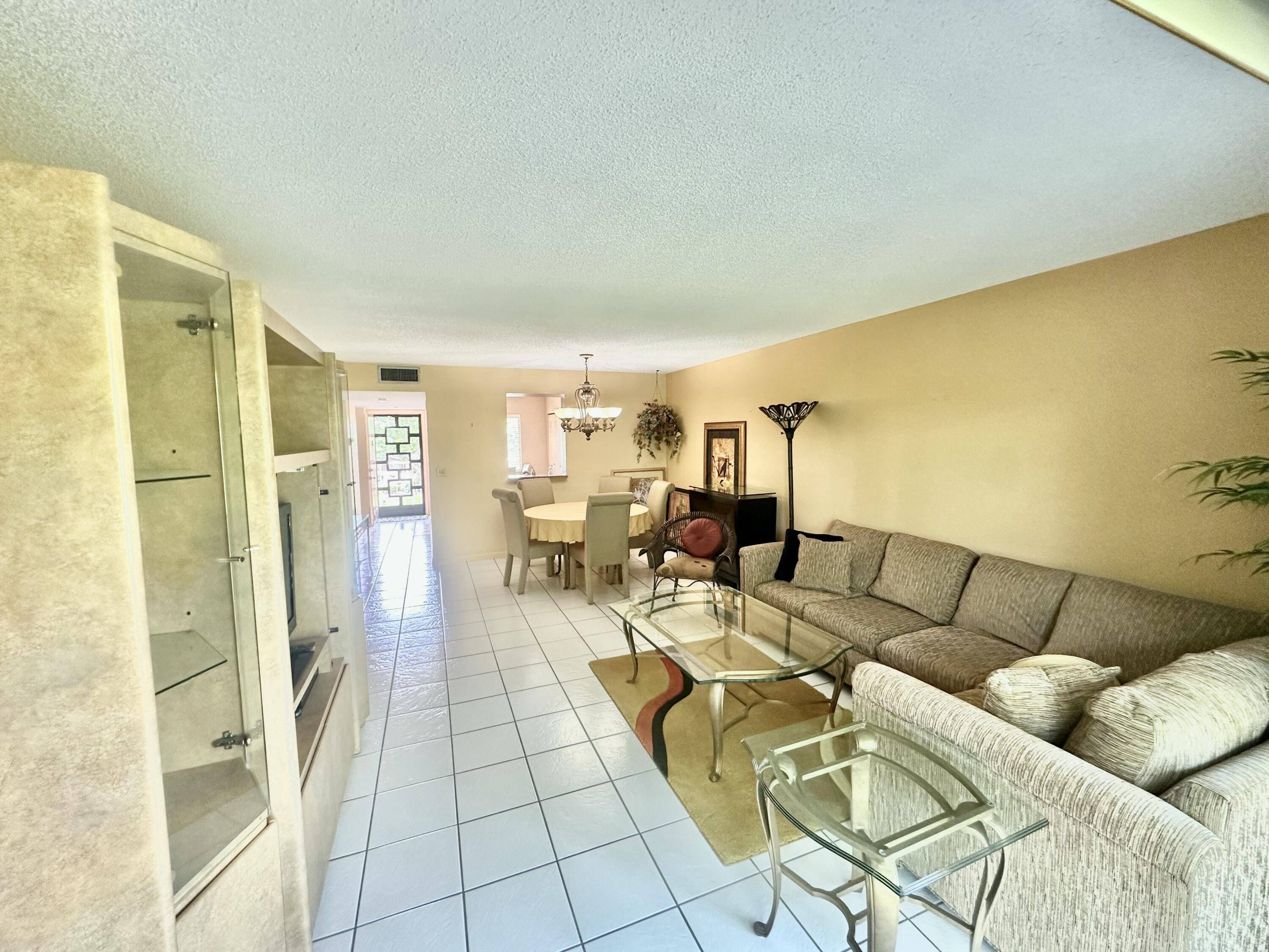 This Lovely third floor condo in the desirable 55 community of Huntington Lakes offers the quintessential resort lifestyle.