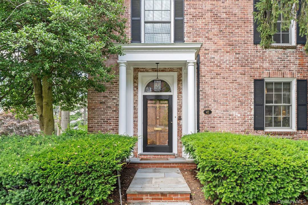 Welcome to 41 Garden Avenue, the much admired Georgian Colonial townhome located across from the desirable Bronxville Schools.