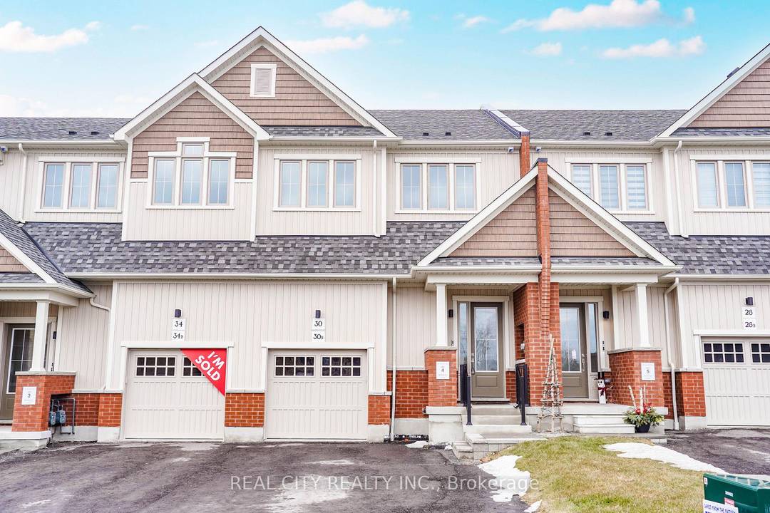 Welcome to 30 Ziibi Way in Newcastle, Clarington a stunning, never lived in 3 bedroom, 3 bath townhome that blends modern comfort with exceptional convenience.