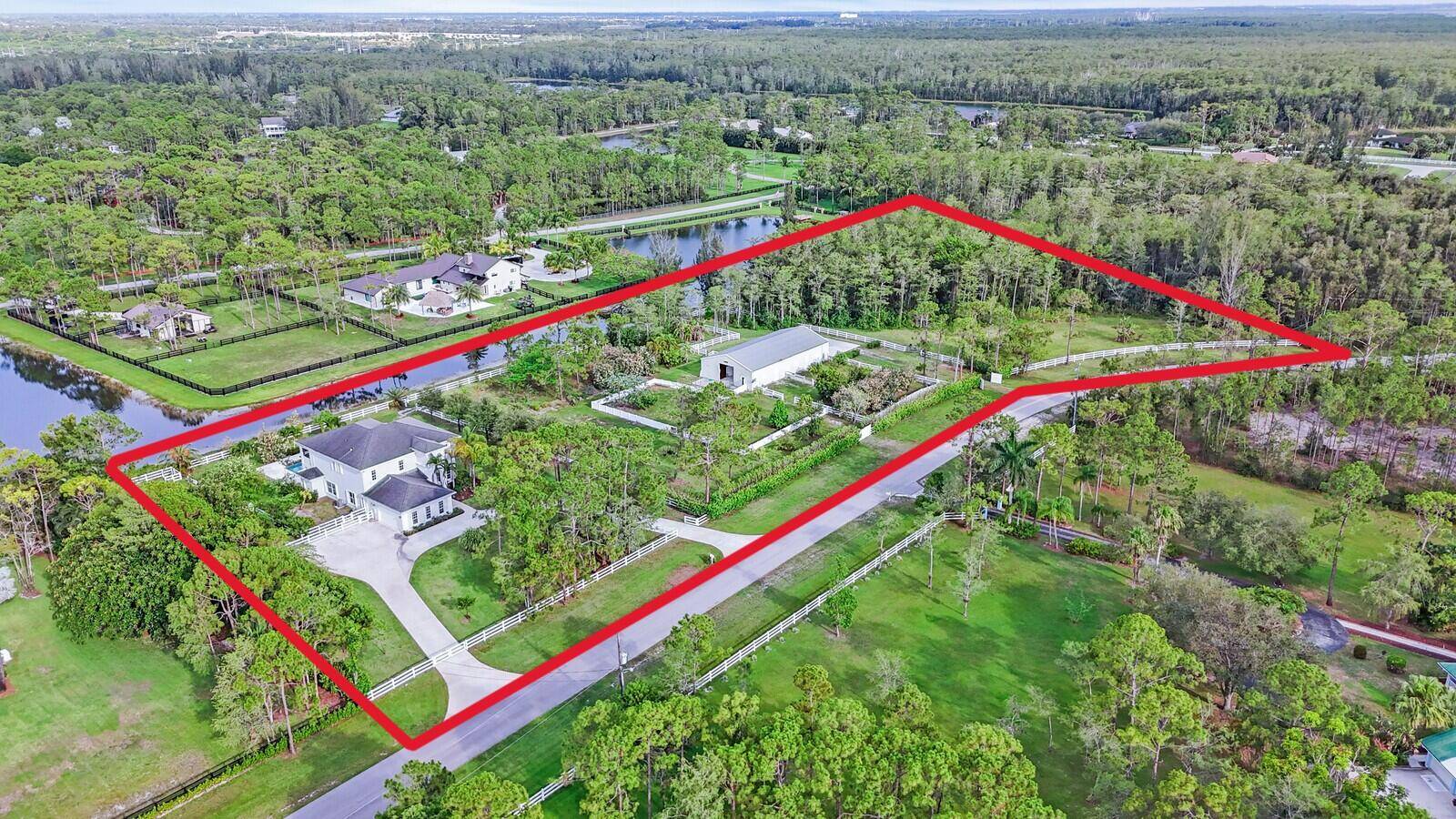 6688 Duckweed Road, Lake Worth, Florida 33449 In The Prestigious Equestrian, Guard Gated Community Of Homeland, Renowned For Its Secluded Charm, Is Set On More Than Five Sprawling Lakefront Acres ...