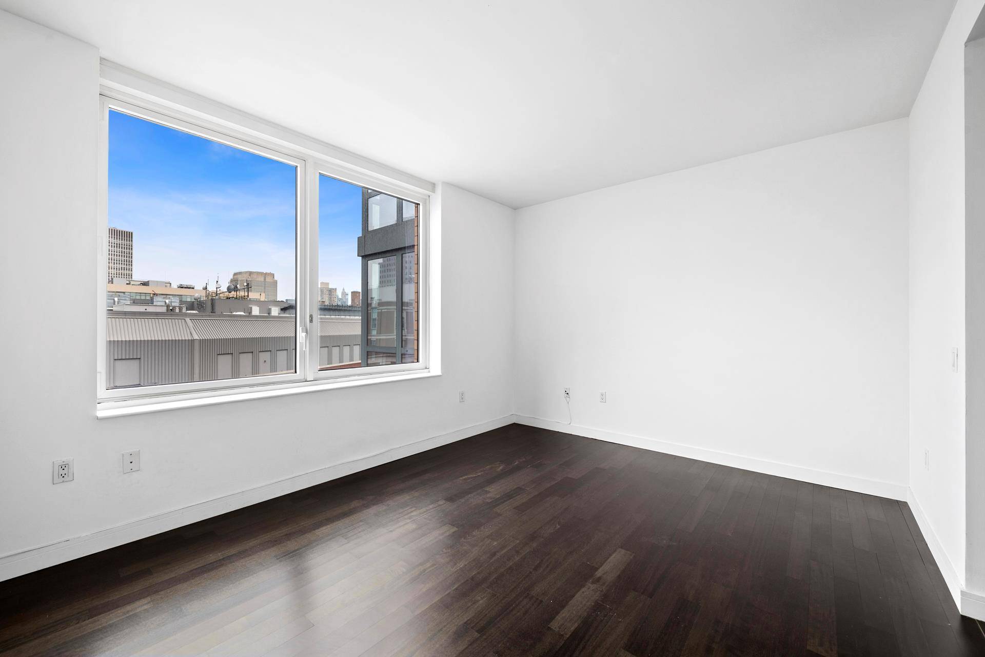 Bright, oversized corner 1BR 1BTH The Oro Condominiums.
