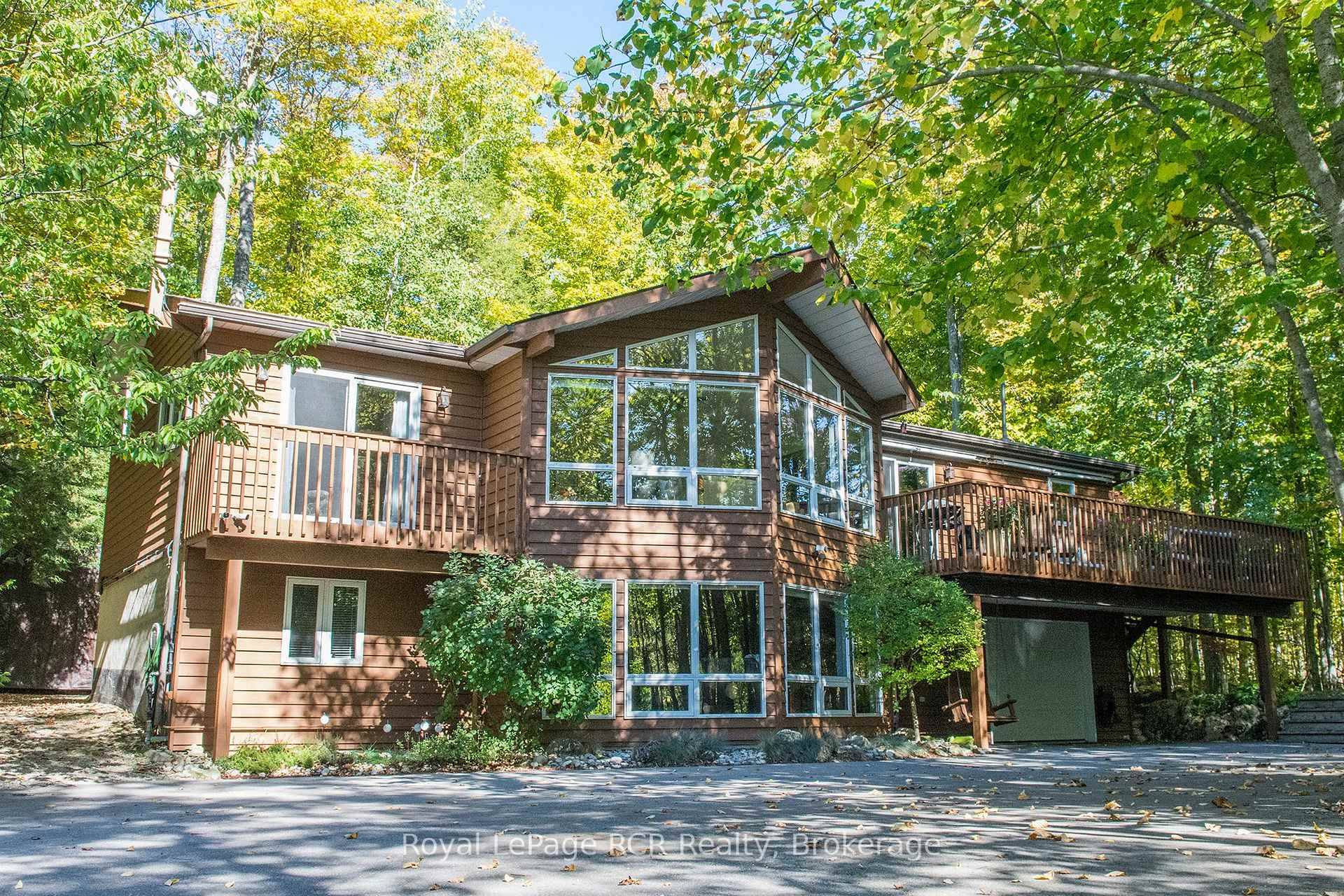 Private 5 Bedroom Home Nestled Among the Trees, and located in a highly sought after area !