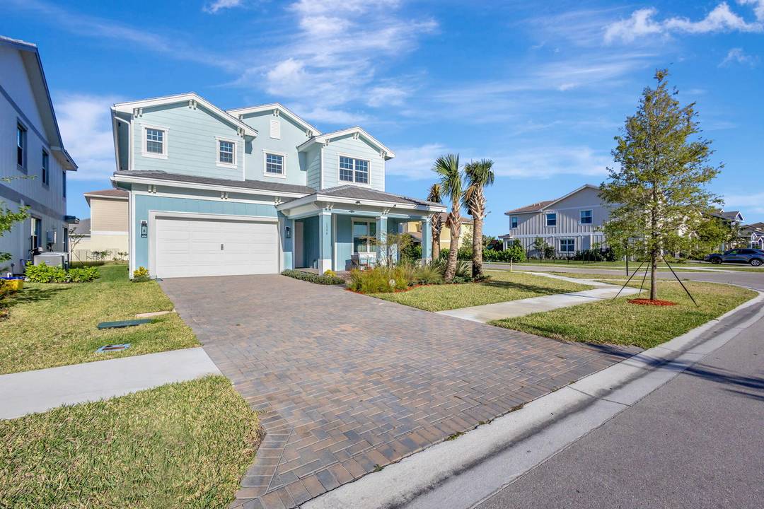 This stunning, newly constructed residence features four bedrooms and three bathrooms in the esteemed Arden community of The Acreage Loxahatchee, Florida.