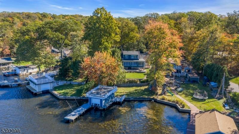 Enjoy the very best of Lake Hopatcong in this charming 4 bedrm, 3 bath home located on what is considered the finest street on the lake a property designed for ...
