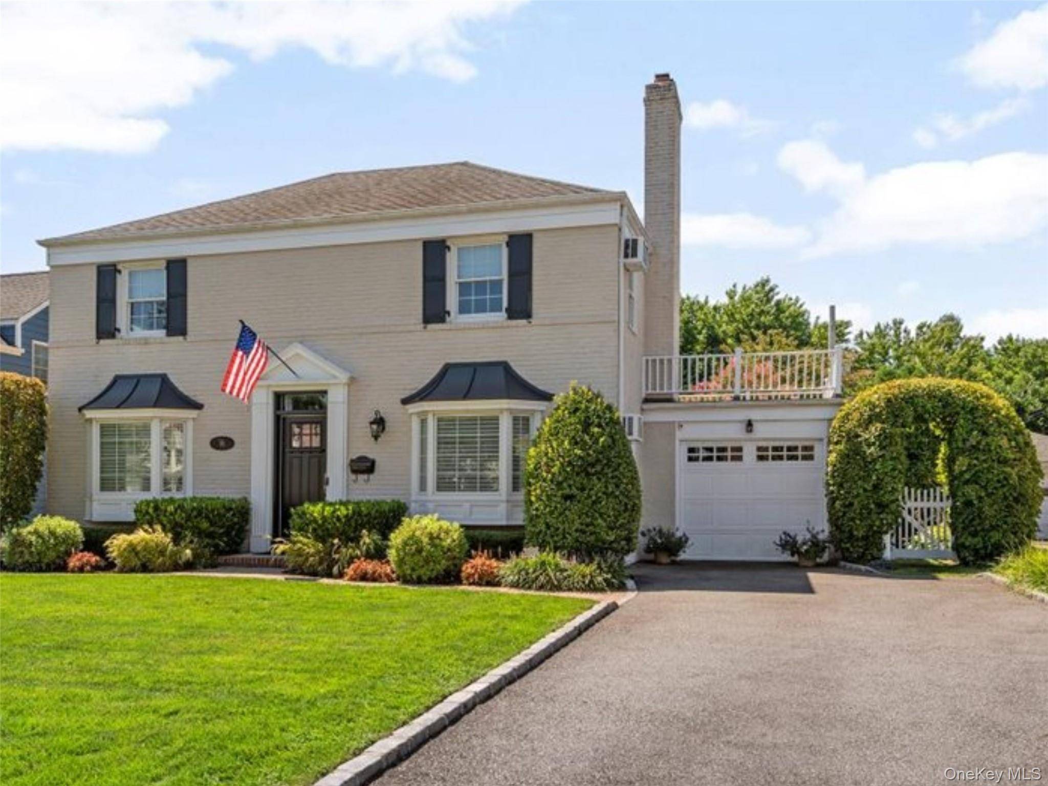 Welcome to 96 Huntington Road, a classic brick and stucco center hall colonial nestled in the highly sought after Mott section of Garden City.