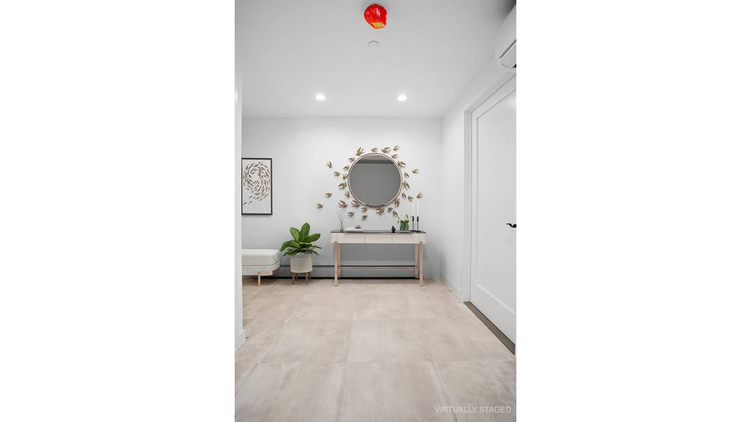 Welcome to your new home in this state of the art 2 bedroom, 2 bathroom condominium in the heart of Flatlands.