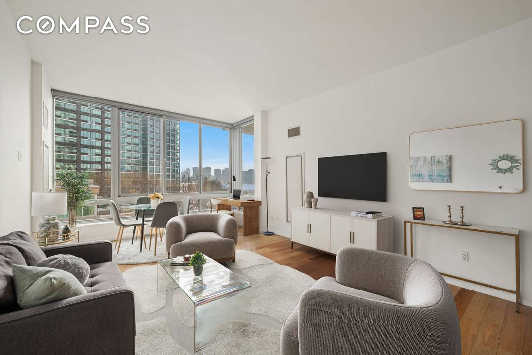 This sprawling sun blasted one bedroom home boasts the most beautiful jaw dropping city and water views directly from your own living room that features floor to ceiling windows.