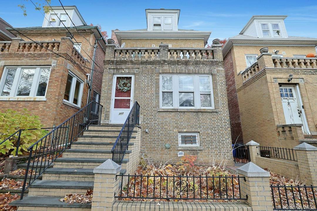 WELCOME HOME TO THIS UNIQUE SINGLE FAMILY, DETACHED BRICK HOME !