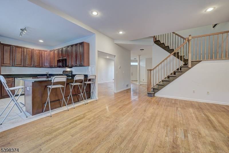 Welcome to this beautifully refreshed, west facing Brookline model townhome nestled within a prestigious gated community.