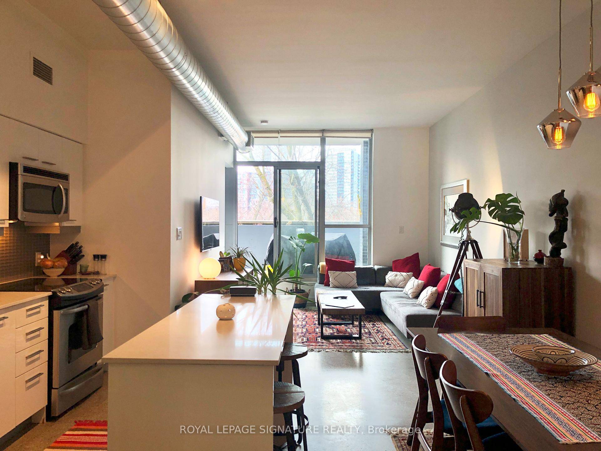 Large functional 2 bed den condo with 2 bathrooms amp ; a full width private terrace away from the streetcar noise.