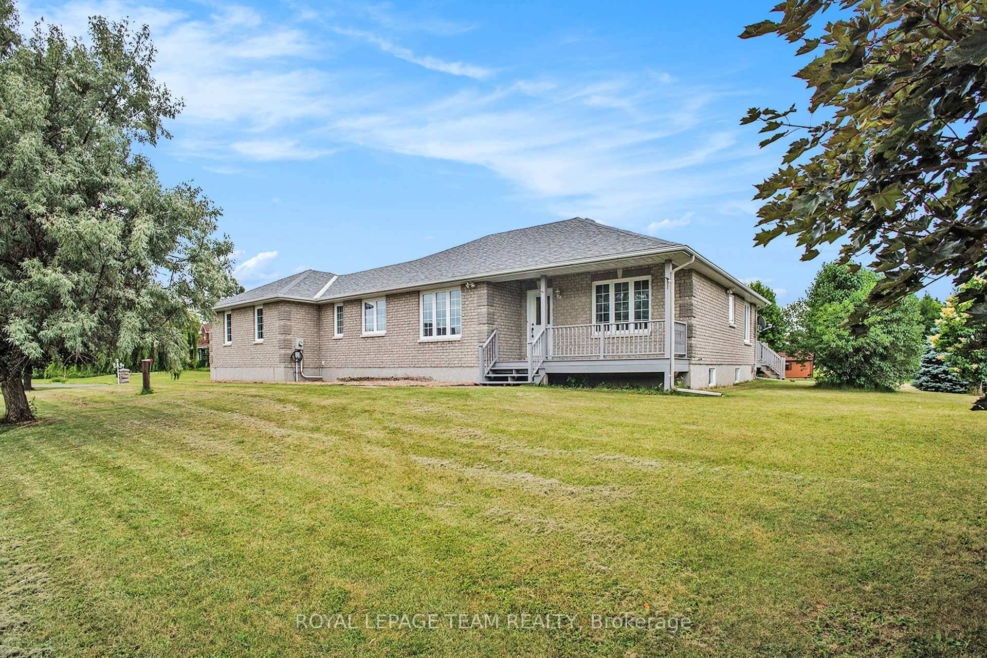 Nestled within the prestigious community of Settlers Grant, this distinguished all brick bungalow exemplifies refined country living.