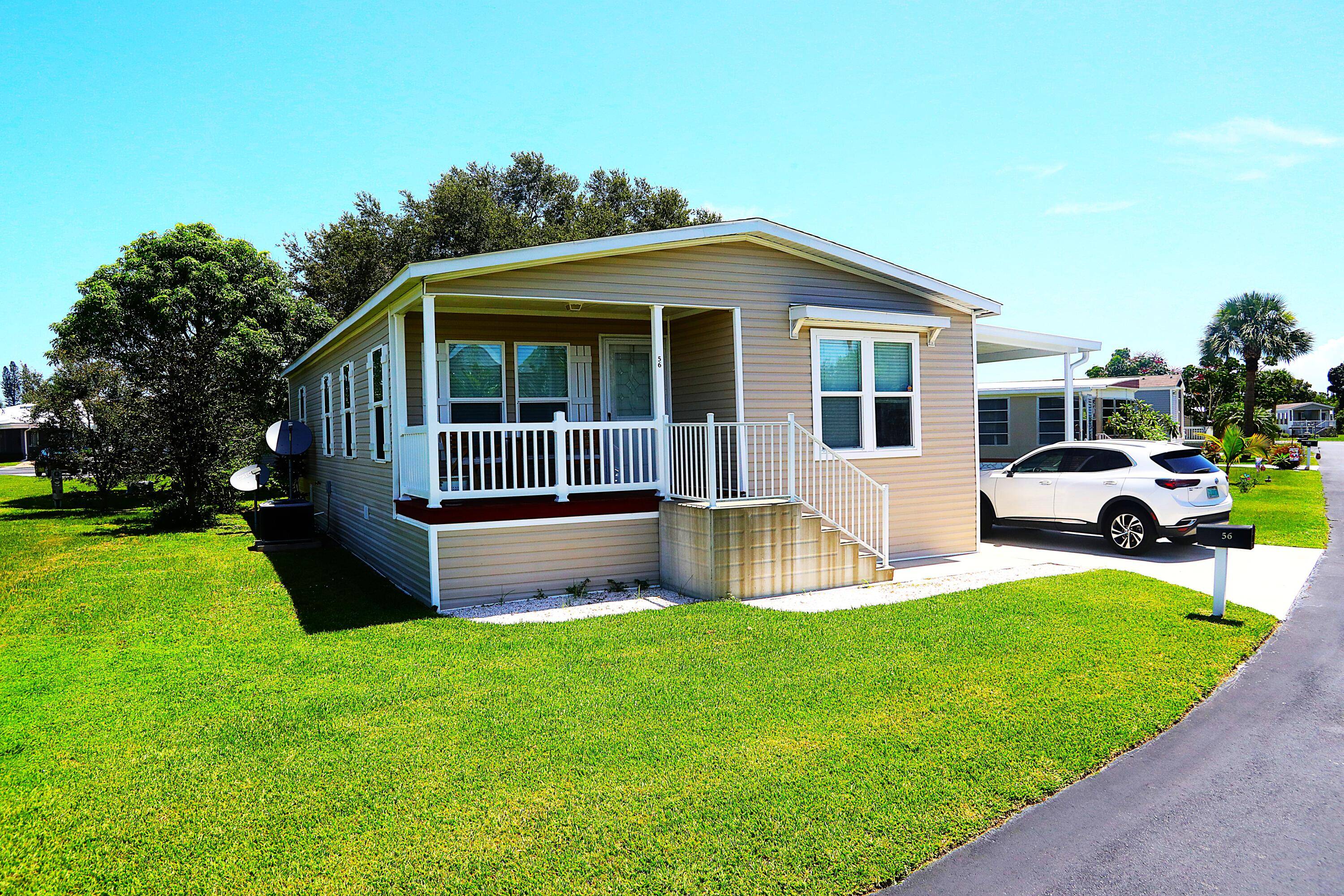 Welcome to 56 Manor Drive, a stunning property nestled in the heart of the prestigious Sandhill Shore community.
