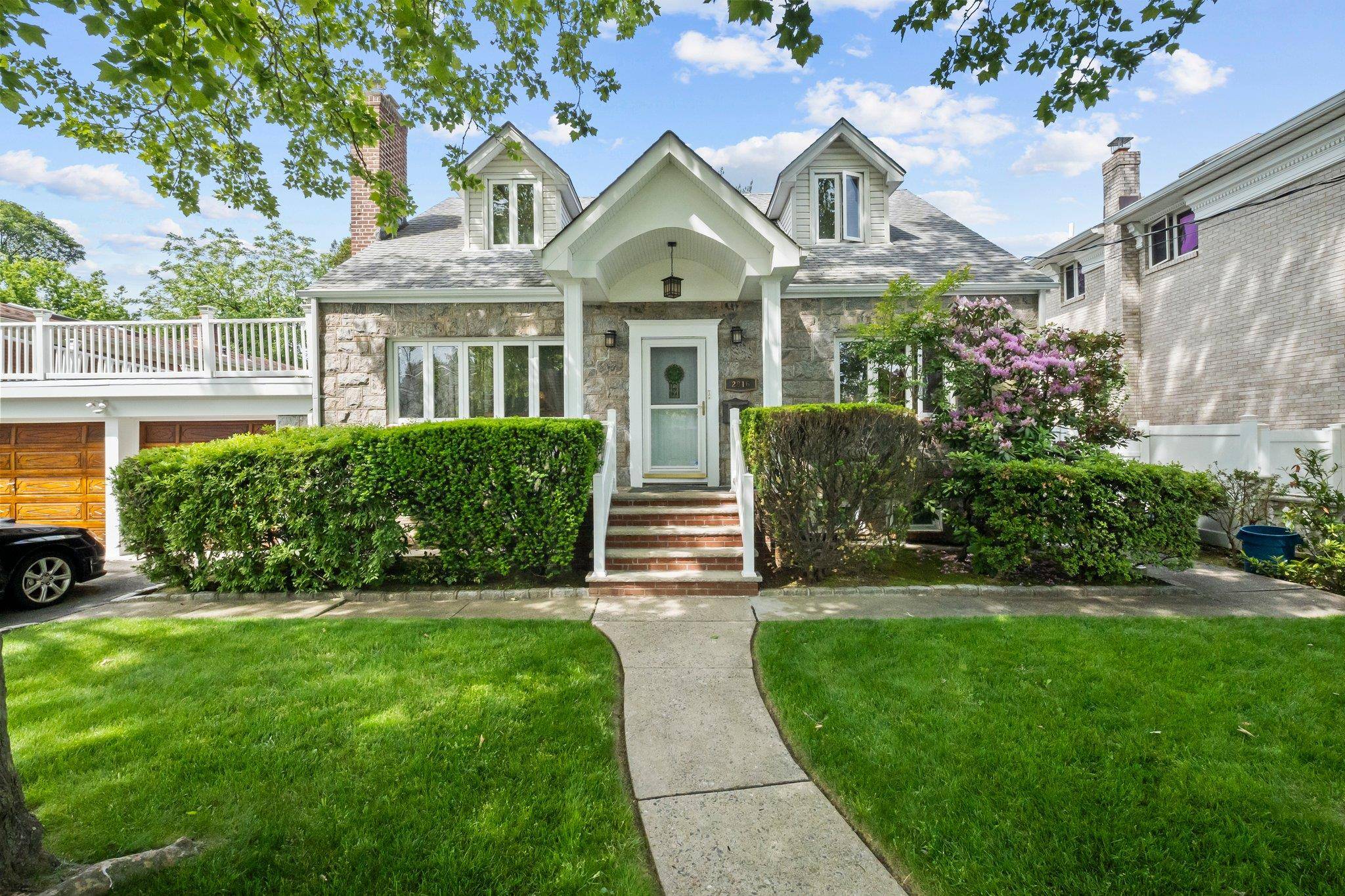 Expanded Cape on Oversized Lot Near Bayside Gables Two Family Zoned.