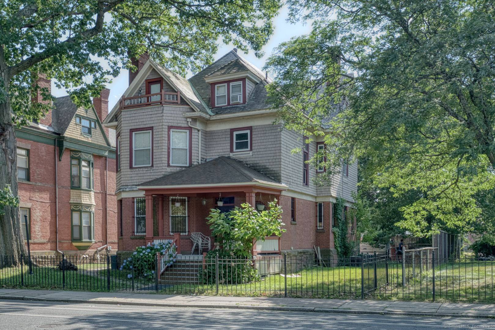 Welcome to 91 Wethersfield Avenue, a beautifully preserved 3 family Victorian nestled in Hartford's historic South Green neighborhood.