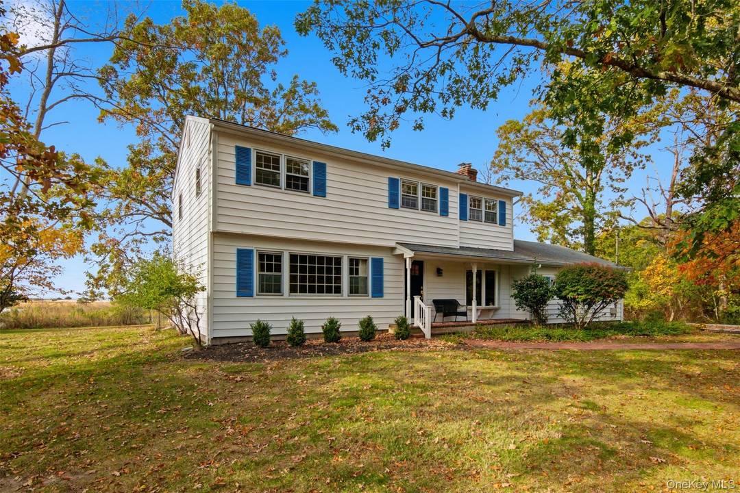 Welcome to Flax Ponds ! This spacious colonial offers breathtaking water views of Flax Pond and the Long Island Sound.